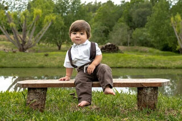 A baby boy wearing a chocolate colour suit set from OleOle