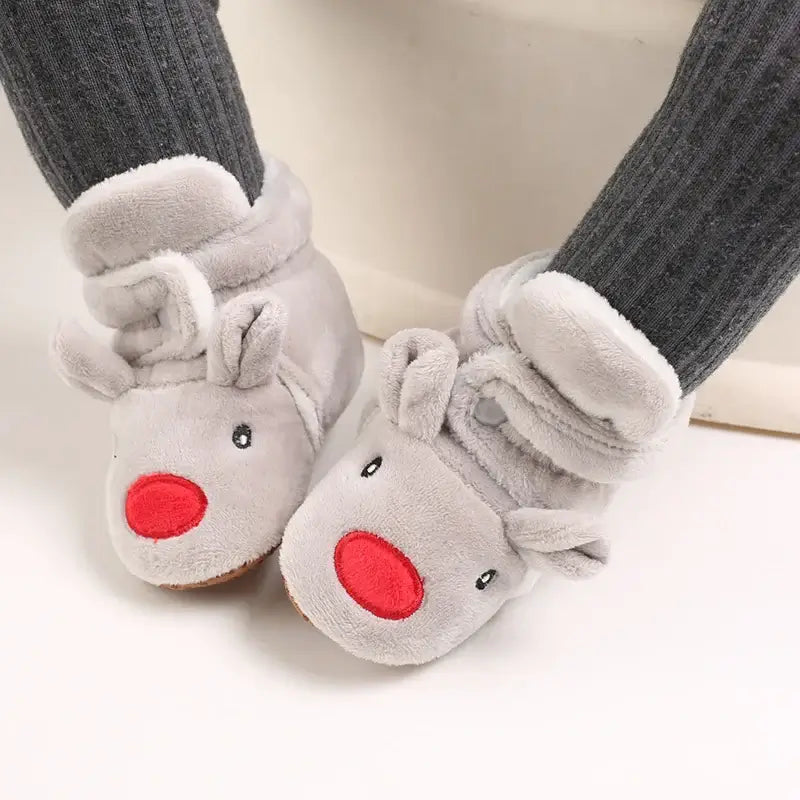 Anime design winter shoes for newborns, plush warmth, soft cloth sole, winter protection, suitable for baby aged 0-18 months.