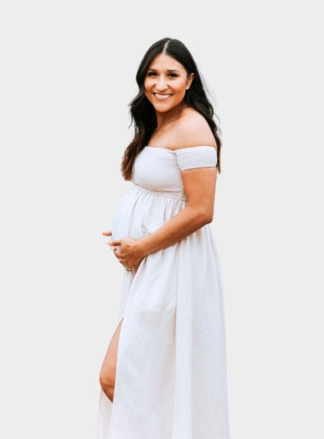 Image of a pregnant women wearing white maternity photoshoot dress - it is used at OleOle Mum Essentials Collection Page