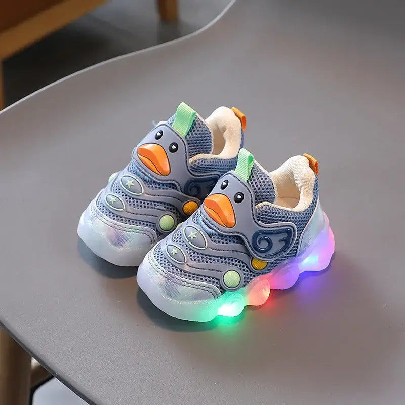 Colorful shoes with lights for kids shaped like a duck, designed for comfort and fun. Perfect light up sneakers for little adventurers.