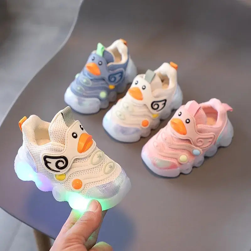 Colorful Shoes with Lights for Kids featuring duck designs, light-up sneakers in pink, blue, and white for playful adventures.
