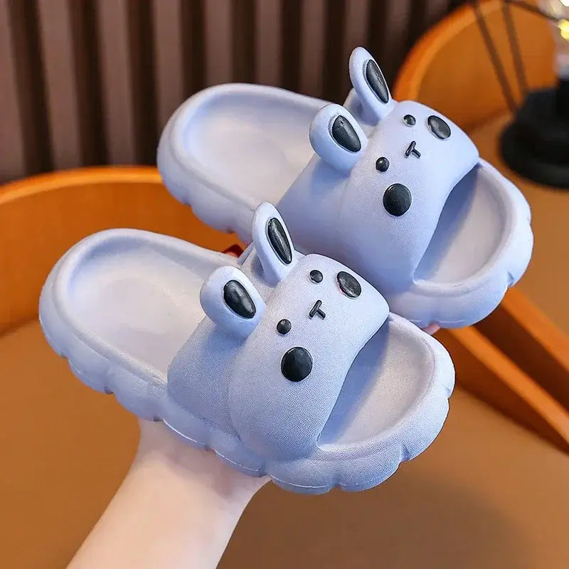 Adorable baby girl cartoon slippers in light purple with cute bunny design, perfect for toddlers and kids ages 1-7.