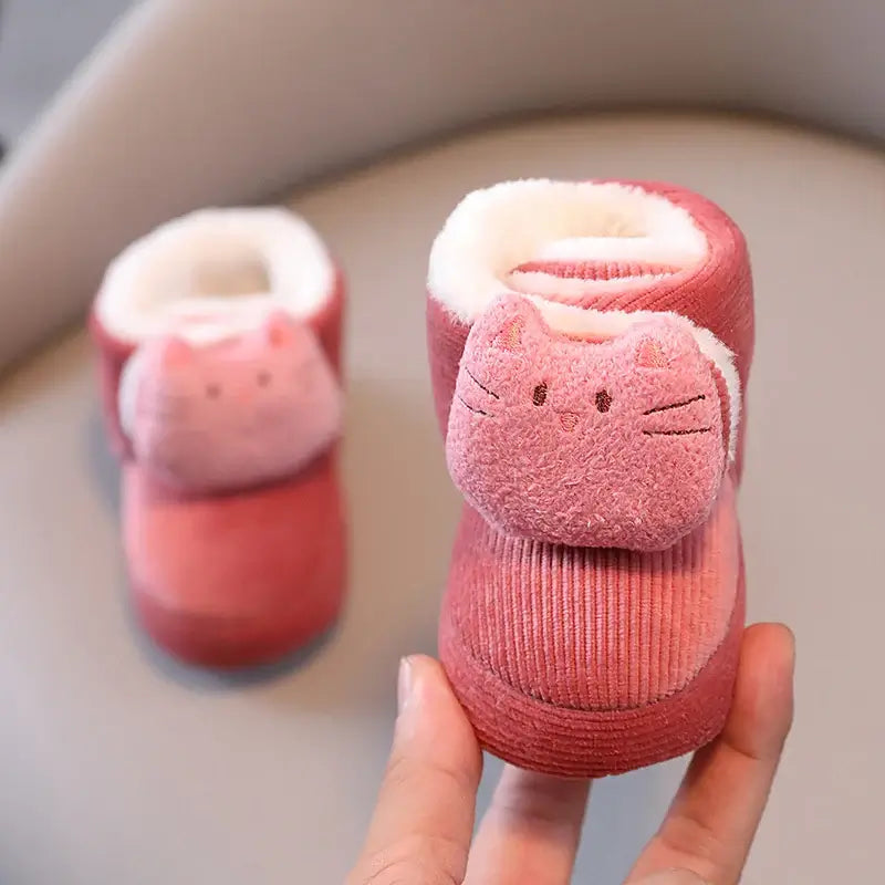 Anime design winter shoes for newborns, plush warmth, soft cloth sole, winter protection, suitable for baby aged 0-18 months.