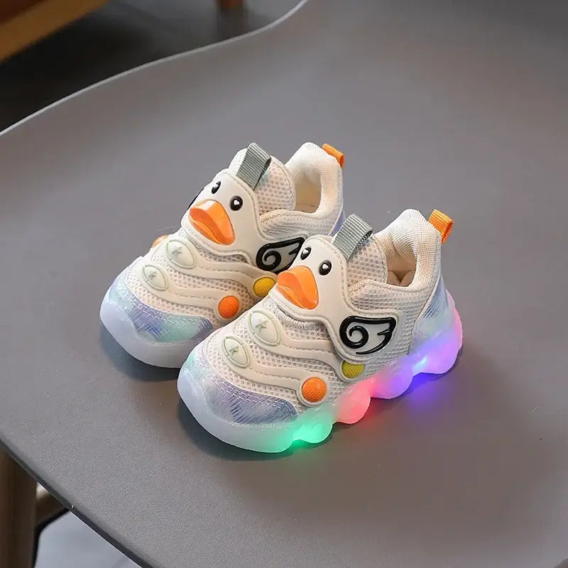 Adorable shoes with lights for kids featuring a cute duck design and colorful LED lights, perfect for little adventurers.