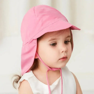 A girl wearing a pink sun hats for ultimate protection.