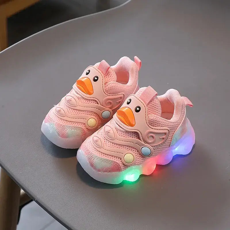 Pink kids shoes with lights featuring a cute duck design, perfect light up sneakers for fun and comfort.
