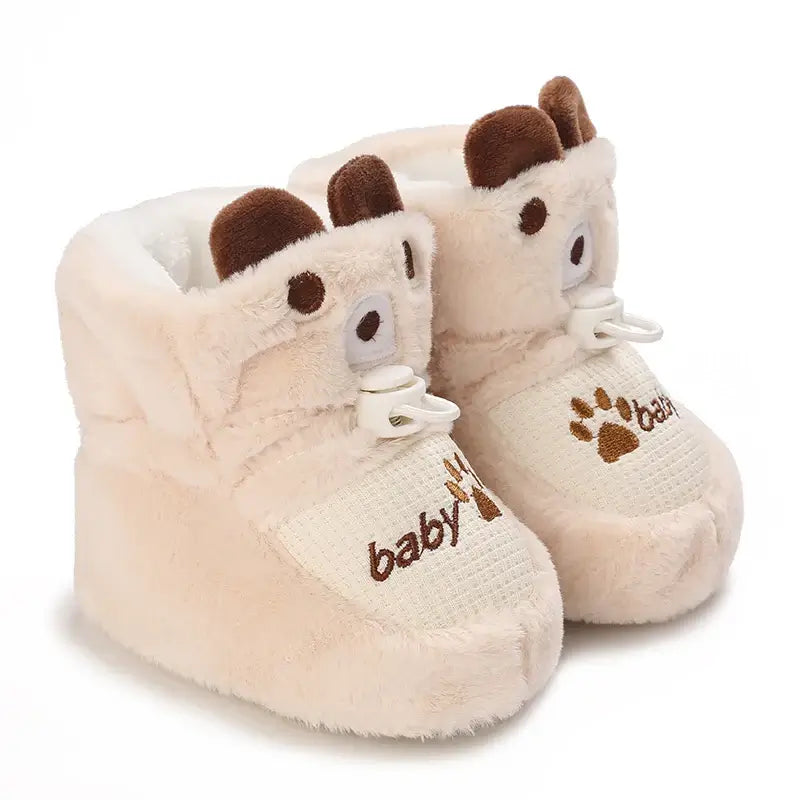 Anime design winter shoes for newborns, plush warmth, soft cloth sole, winter protection, suitable for baby aged 0-18 months.