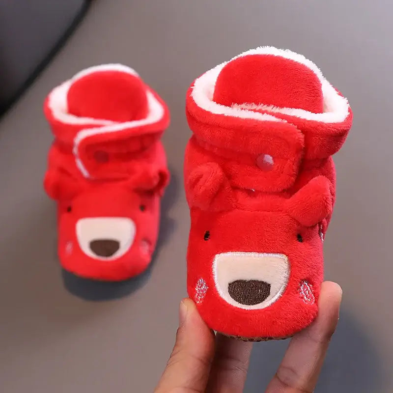 Anime design winter shoes for newborns, plush warmth, soft cloth sole, winter protection, suitable for baby aged 0-18 months.