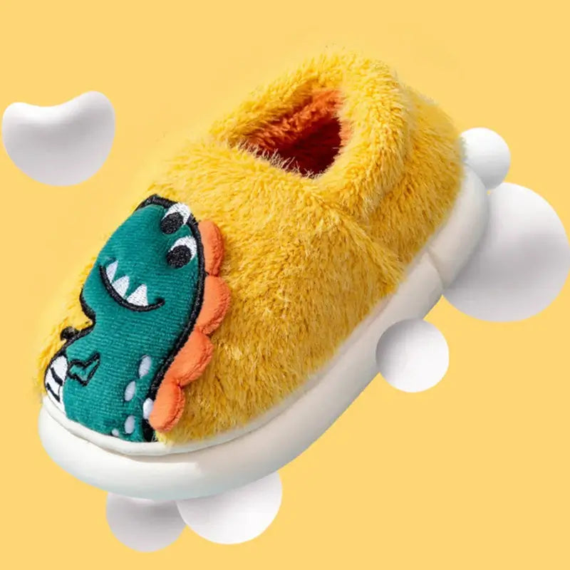 Cartoon Dino Plush Winter Slipper for Kids in yellow, featuring playful dino embroidery, ideal for toddlers.