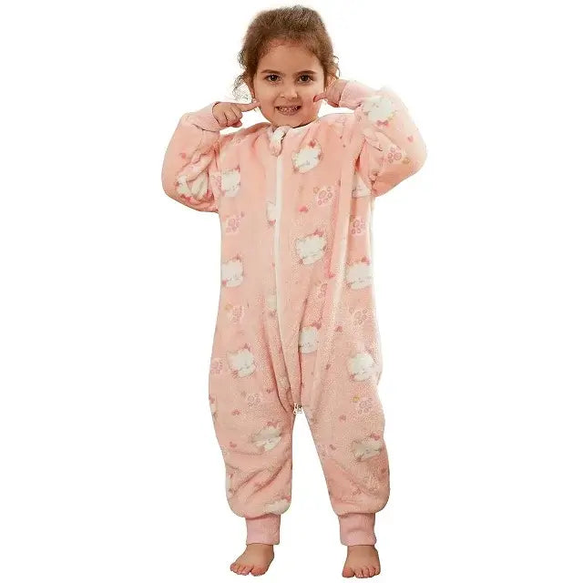 Girl in a pink flannel onesie sleepsack with cartoon clouds, perfect for cozy nights and sweet dreams.