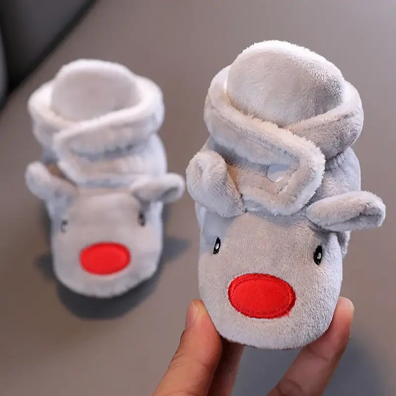 Anime design winter shoes for newborns, plush warmth, soft cloth sole, winter protection, suitable for baby aged 0-18 months.