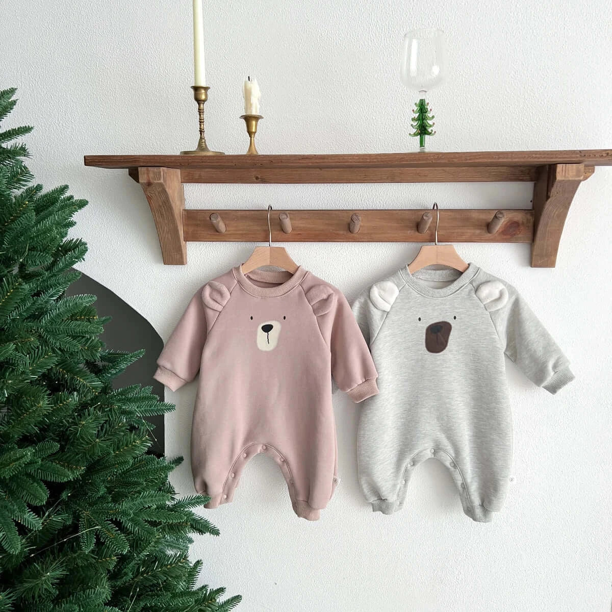 Image of cosy fleece baby onesie with bear ears, perfect for winter comfort. Shop now at OleOle.
