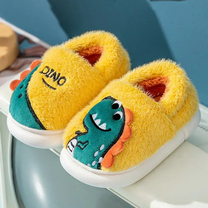 Cartoon dino winter plush slippers for kids, perfect for toddlers aged 1-6, ensuring warmth and comfort.