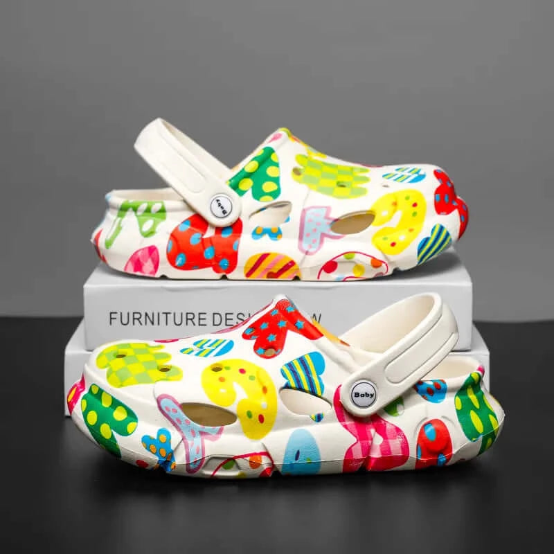 Image of colourful children's clogs featuring stylish anime characters with comfortable holes design. Buy now at OleOle.