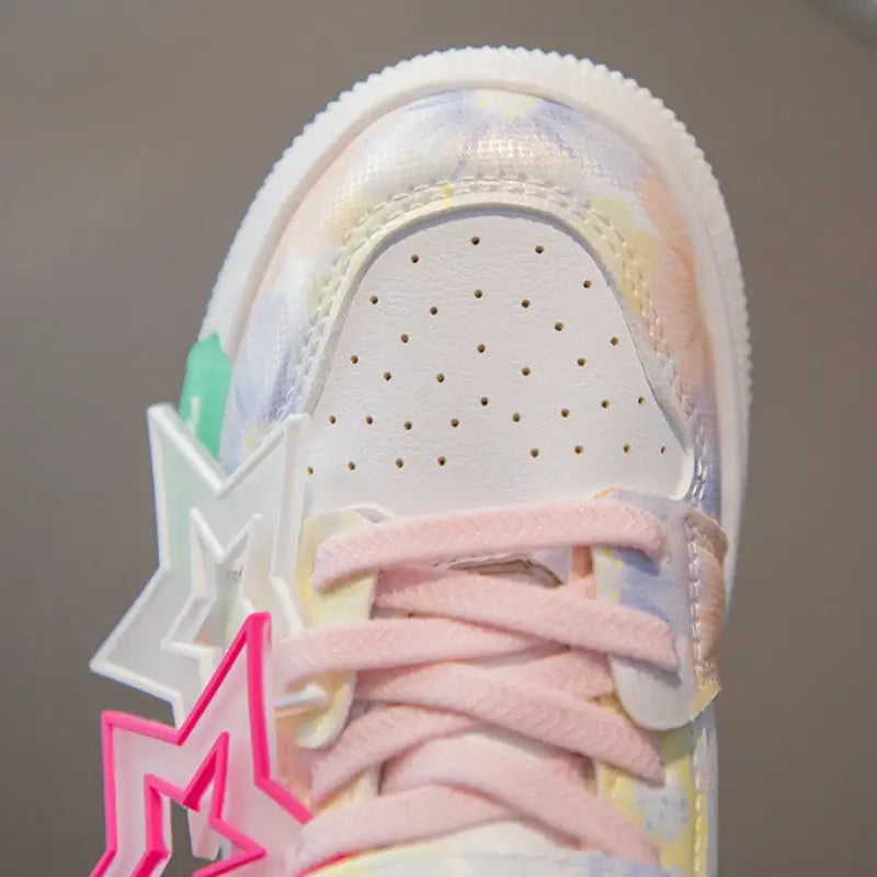 Kids girls fashion sneakers with colorful design and pastel accents, featuring playful star-shaped decorations.