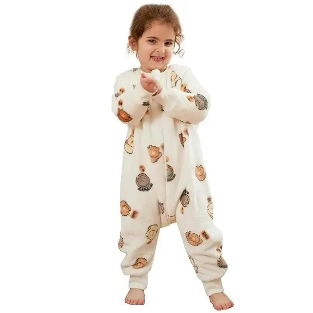 Smiling girl in cozy flannel kids onesie sleepsack with cartoon pattern, perfect for ages 1-7 years.