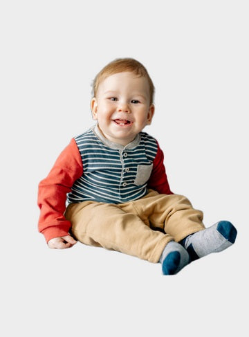 Image of a Smiling Baby Boy wearing charming top, pant and socks - it is used at OleOle Baby Boy Clothes Collection Page