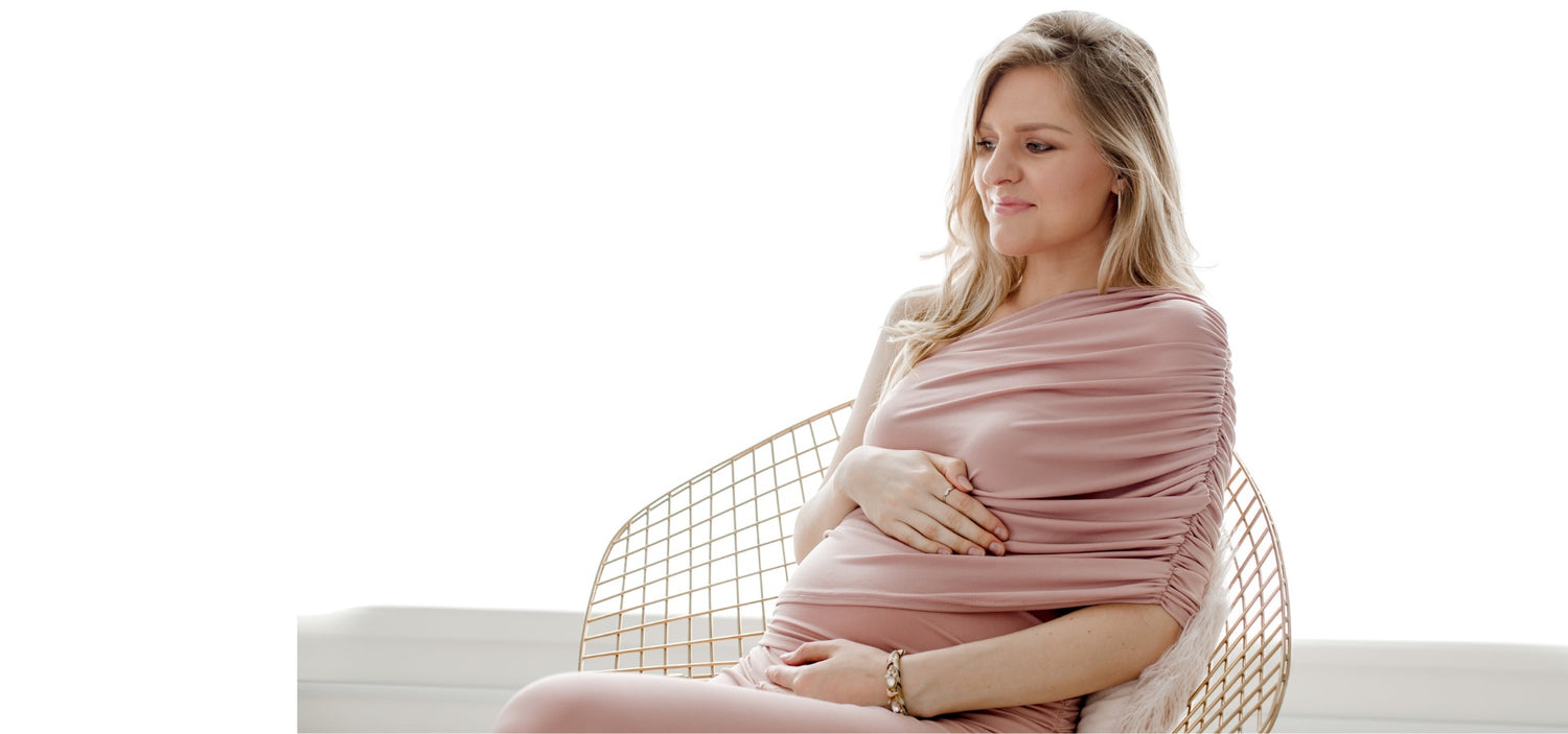Image of a Pregnant Woman wearing a stylish pink maternity dress - this image is used on OleOle Home Page for Mum Essentials Collection - Thoughtfully chosen products to enhance the journey of motherhood