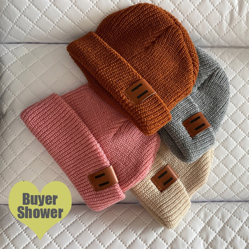 Image of Adorable handmade knitted winter caps for baby girls & boys ages 1-4yrs. Stay cosy in style with our charming collection. Perfect cold-weather accessories!