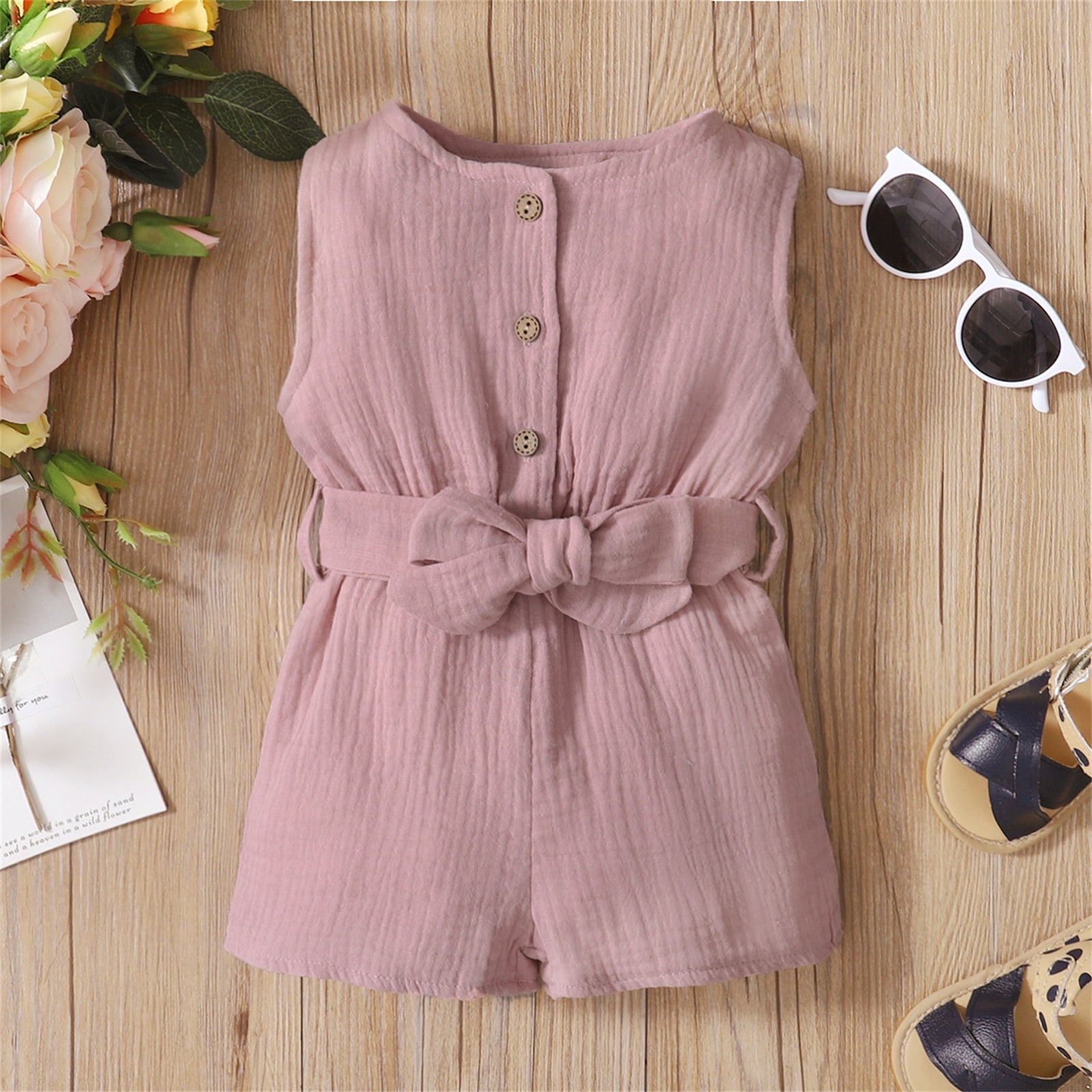 Image of Chic and comfy Premium Linen Sleeveless Romper for baby girls ages 0-18 months. Adorable style for every little fashionista. Buy now for your precious one at OleOle.