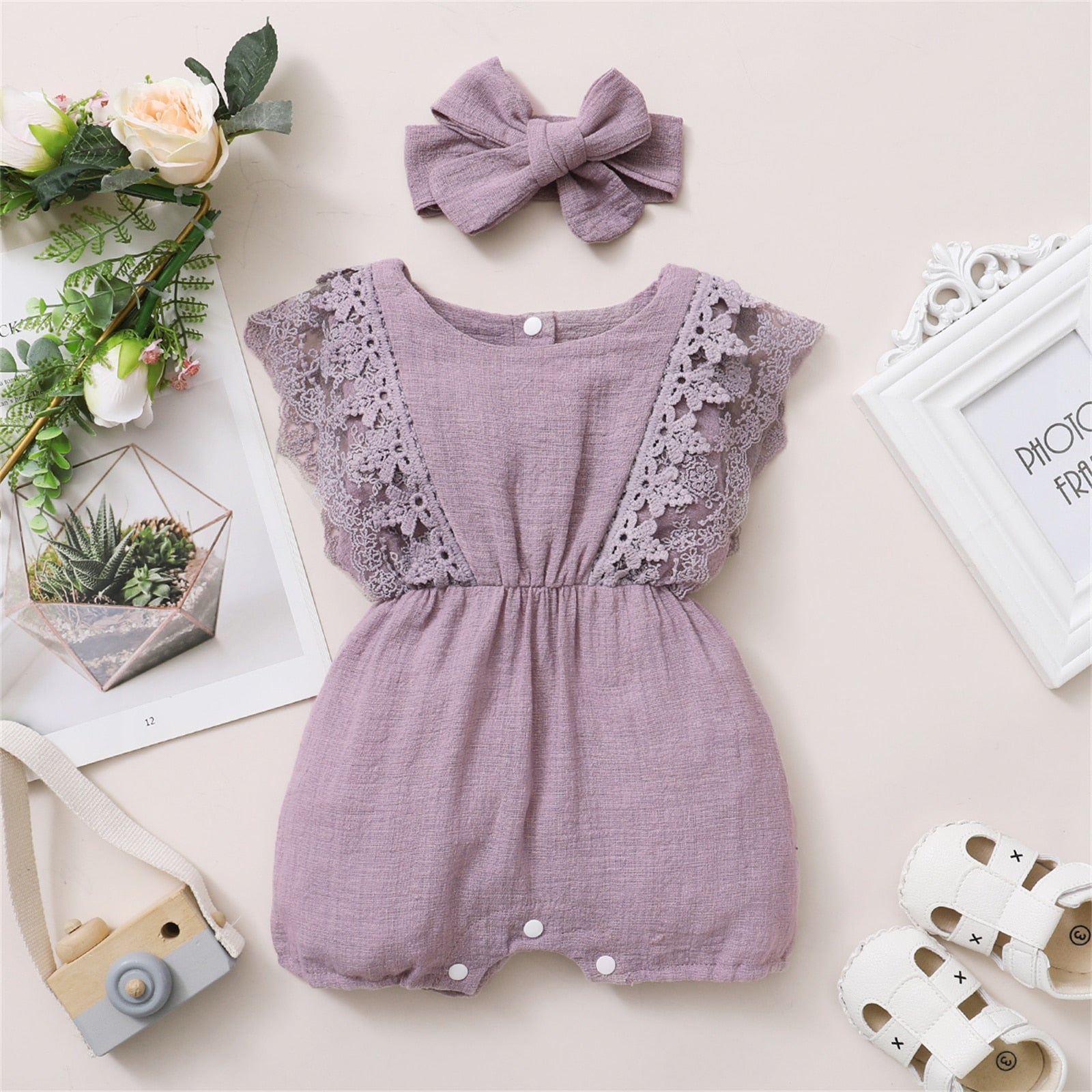 Image of Adorable linen jumpsuit for baby girls at 3-18 months with matching headbands. Perfect for sunny days. Stylish and comfy ensemble. Chic summer vibes available at OleOle.