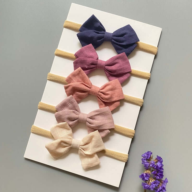 A set of 5 OleOle baby girl headband bows, perfect for adding a touch of elegance to any outfit.