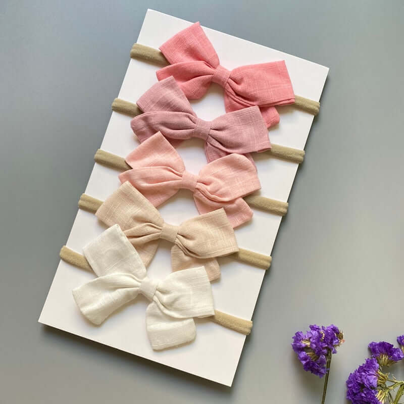 A set of 5 OleOle baby girl headband bows, perfect for adding a touch of elegance to any outfit.