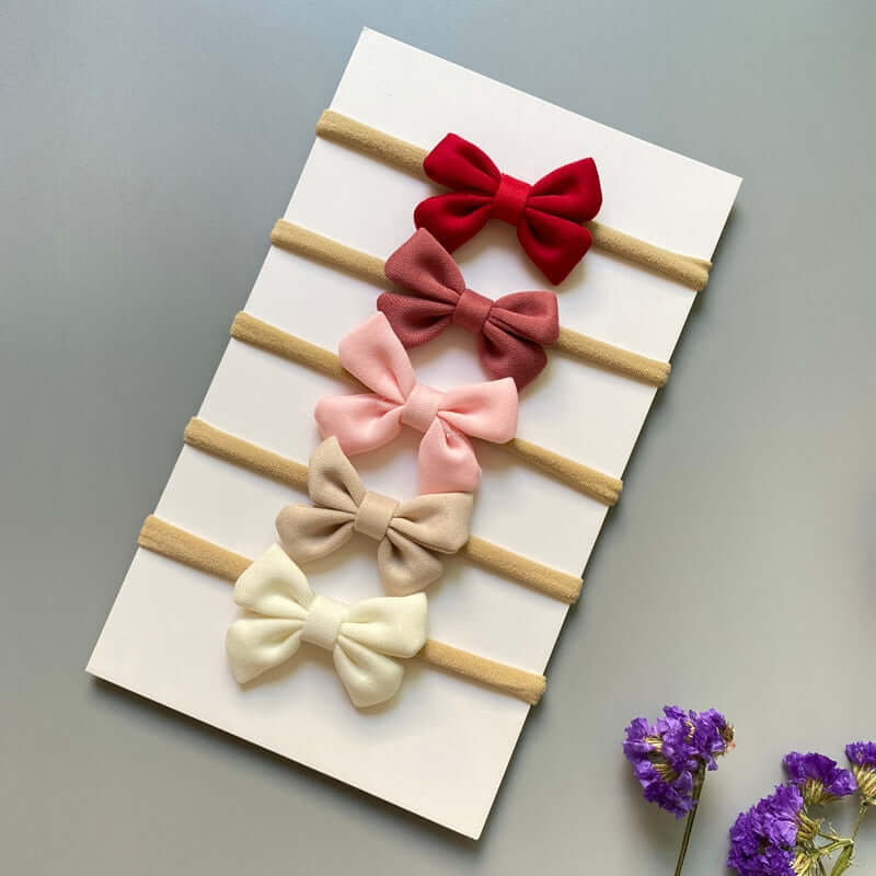 A set of 5 OleOle baby girl headband bows, perfect for adding a touch of elegance to any outfit.