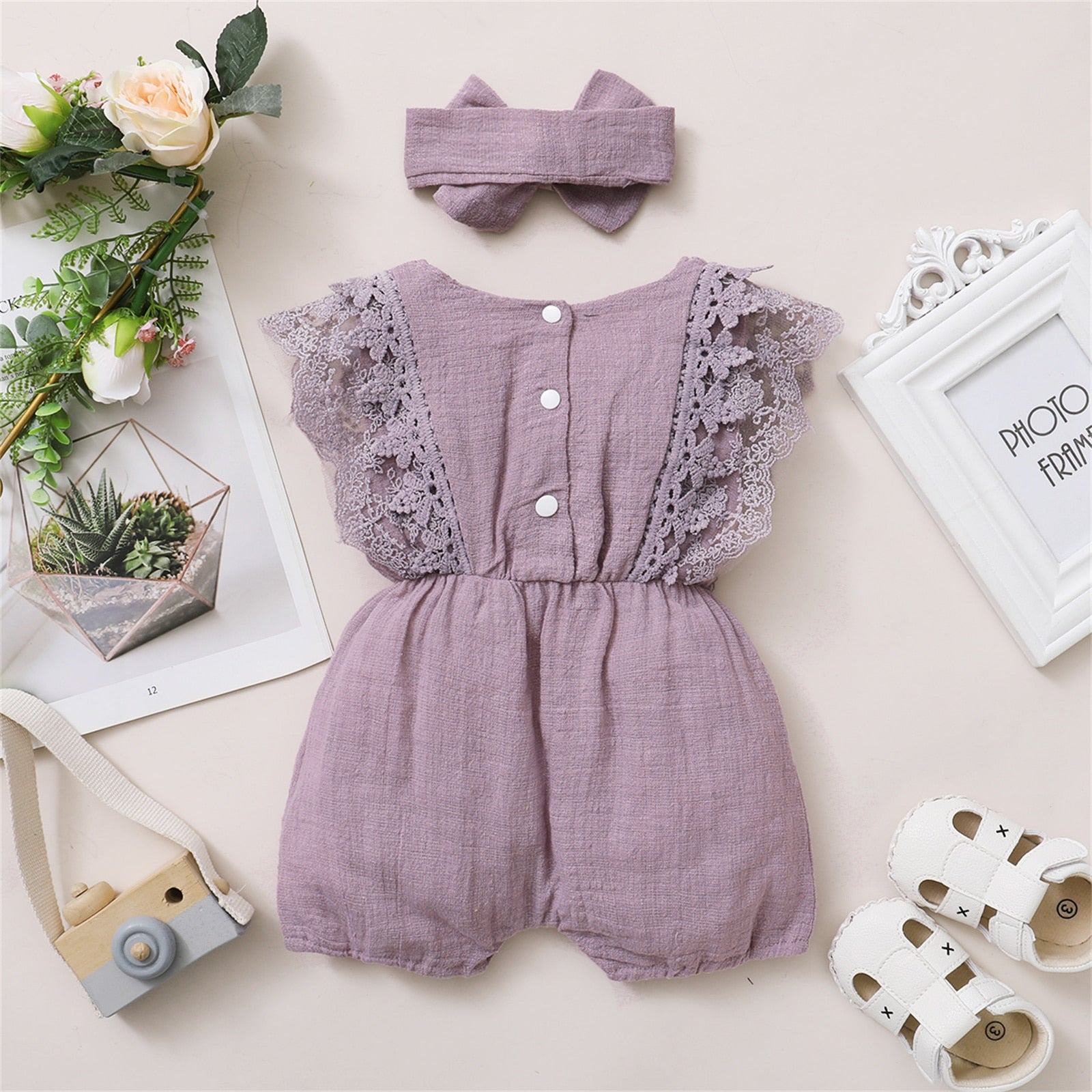 Image of Adorable linen jumpsuit for baby girls at 3-18 months with matching headbands. Perfect for sunny days. Stylish and comfy ensemble. Chic summer vibes available at OleOle.