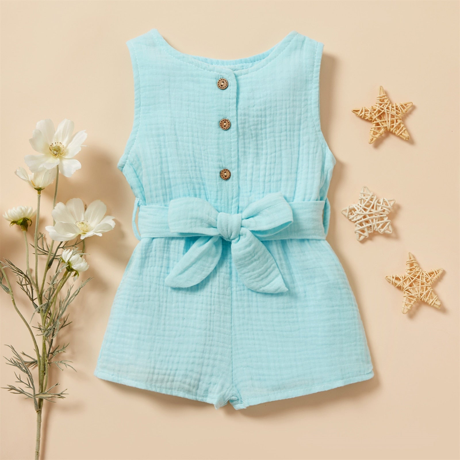 Image of Chic and comfy Premium Linen Sleeveless Romper for baby girls ages 0-18 months. Adorable style for every little fashionista. Buy now for your precious one at OleOle.